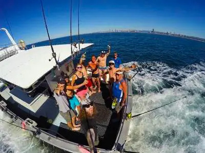 Angler holding large fish on Gold Coast half-day morning fishing trip