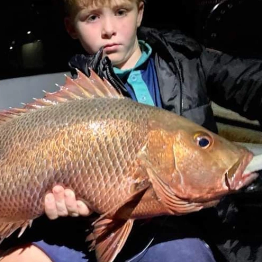 Kid holding the fish